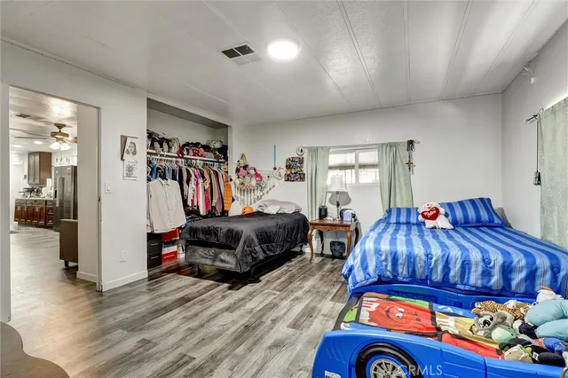 a bedroom with a bed and a view of bedroom