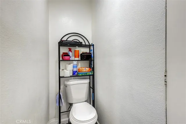 a bathroom with a toilet and a sink