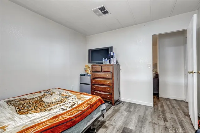 a view of room with wooden floor