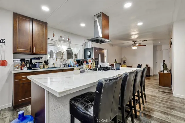 a large kitchen with a table and chairs