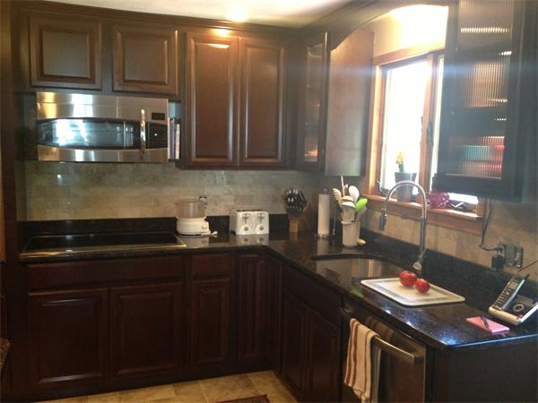 4 West Allen Ridge Road East Longmeadow, MA 01028 - Photo 4 of 9 a kitchen with stainless steel appliances granite countertop a sink a stove and a wooden cabinets