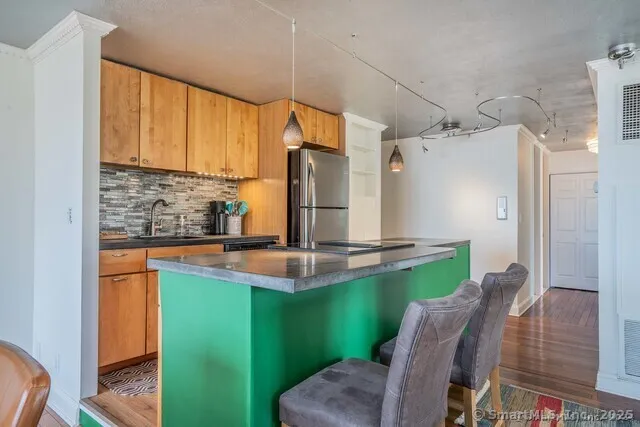 a view of kitchen with cabinets and outdoor seating