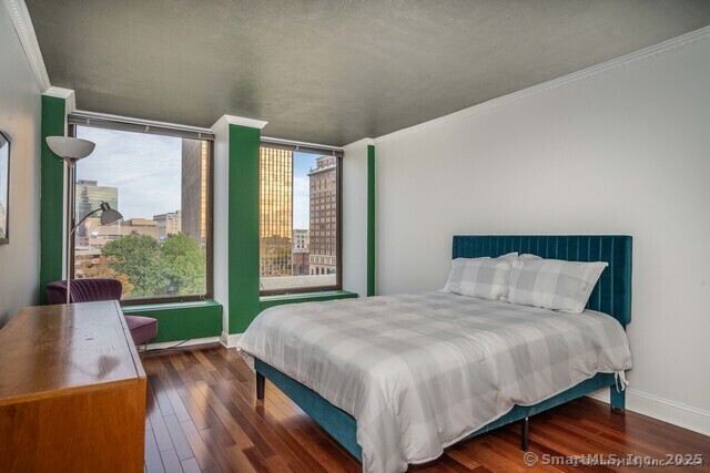 1 Gold Street, Unit 11E Hartford, CT 06103 - Photo 17 of 21 a bed sitting in a bedroom next to a window