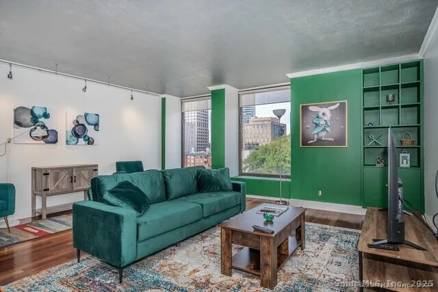 a living room with furniture and a large window