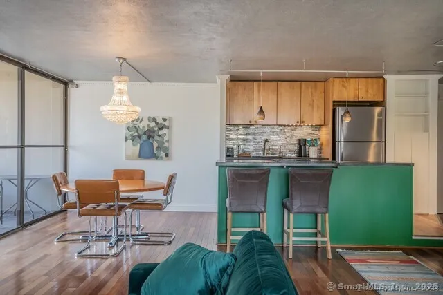a living room with furniture a window and a table