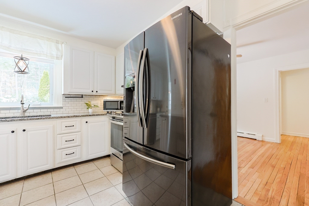 279 South Main Street Hopedale, MA 01747 - Photo 11 of 42 a kitchen with stainless steel appliances a refrigerator sink and cabinets