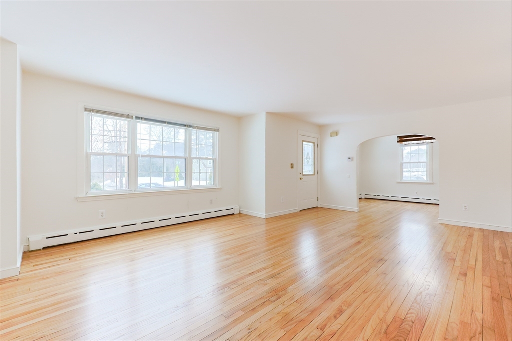 279 South Main Street Hopedale, MA 01747 - Photo 18 of 42 an empty room with wooden floor and windows