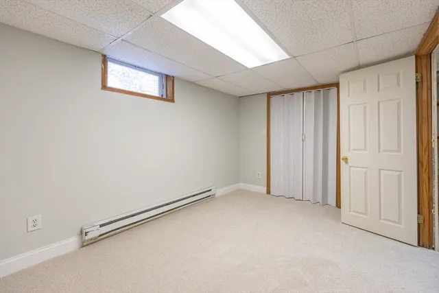 a room with storage and a white door