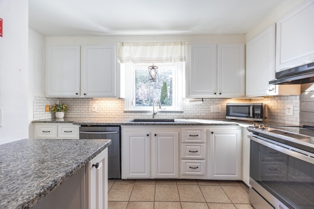 279 South Main Street Hopedale, MA 01747 - Photo 7 of 42 a kitchen with cabinets appliances a sink and a counter top space