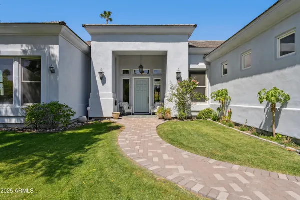 a front view of a house with garden