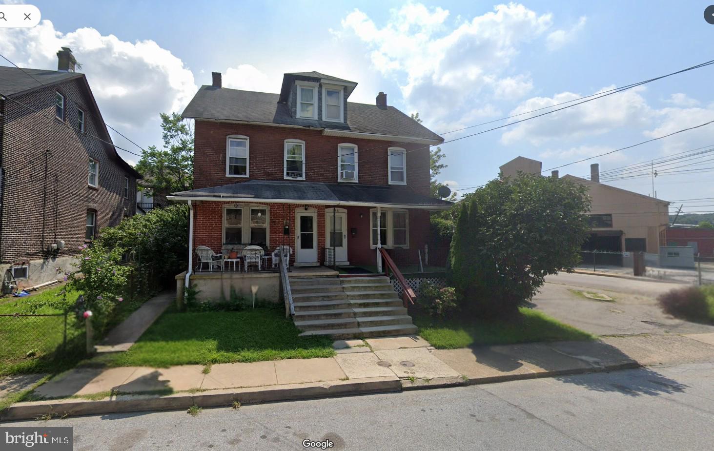 106 Walnut Street Coatesville, PA 19320 - Photo 1 of 1 a front view of a house with garden