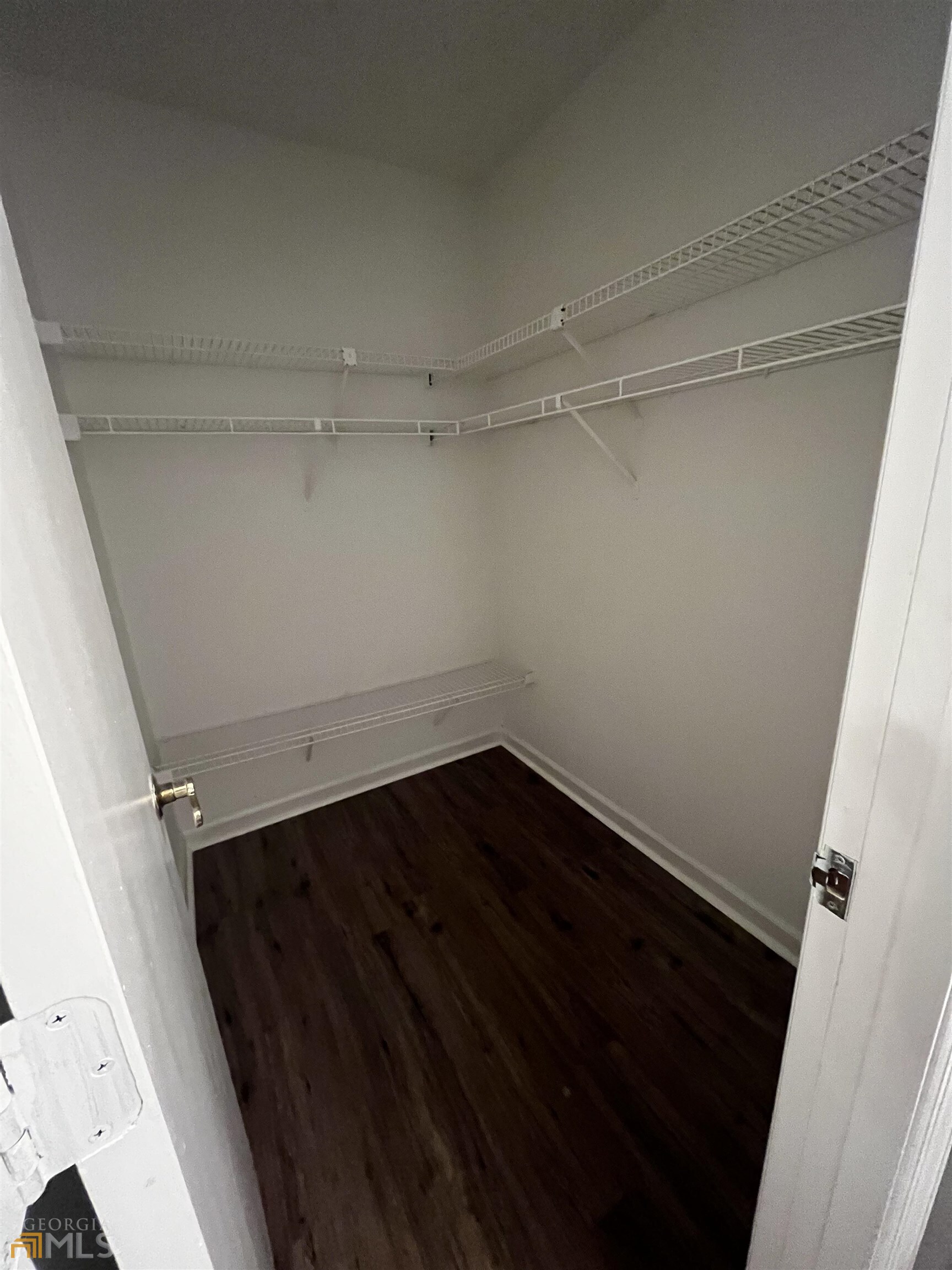320 Broken Lance Place Alpharetta, GA 30022 - Photo 11 of 18 a view of an empty walk in closet