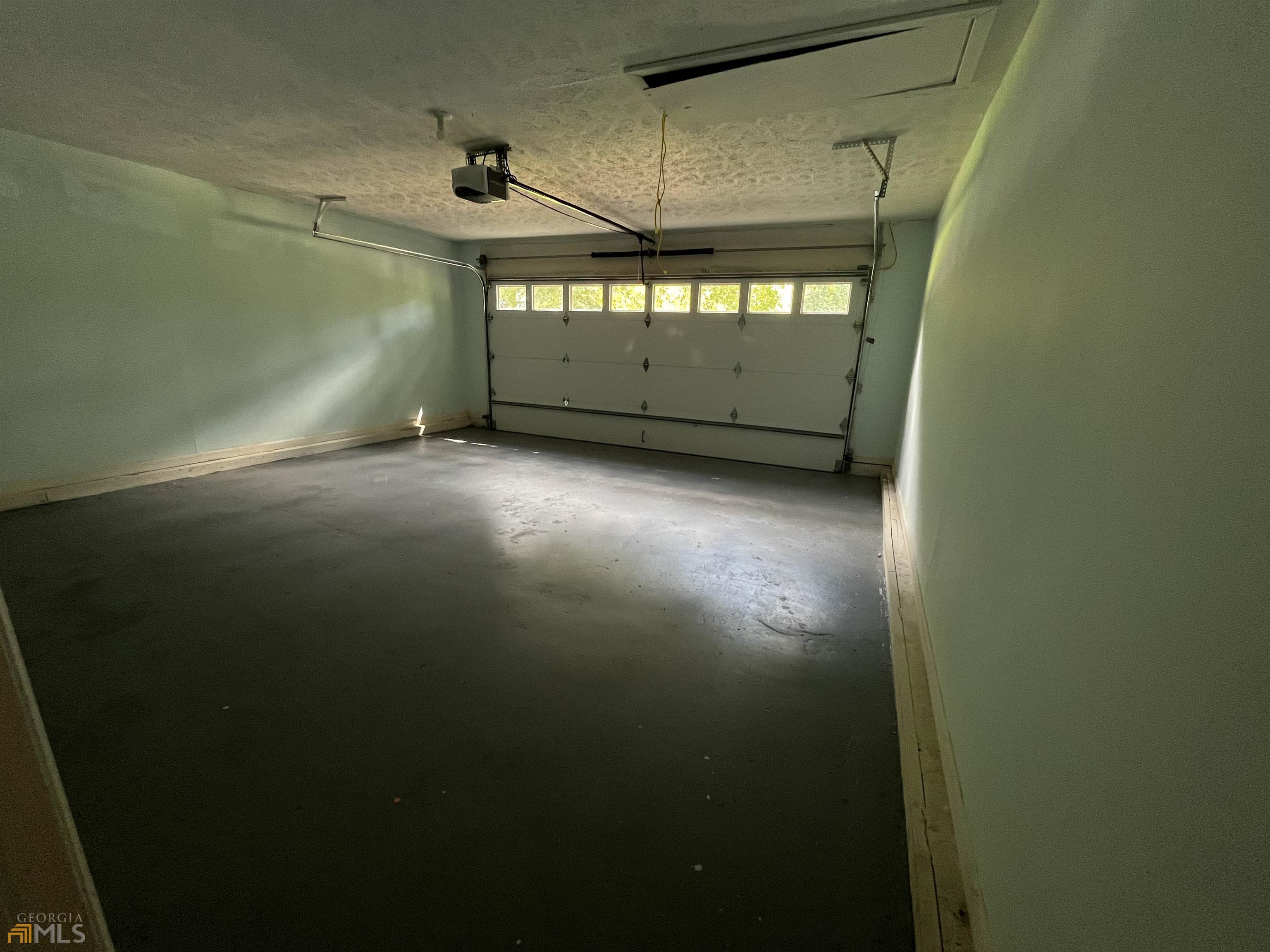 320 Broken Lance Place Alpharetta, GA 30022 - Photo 18 of 18 a view of a garage