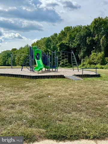 a view of a swimming pool with a yard