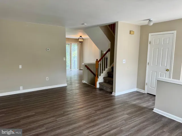 a view of an entryway with wooden floor