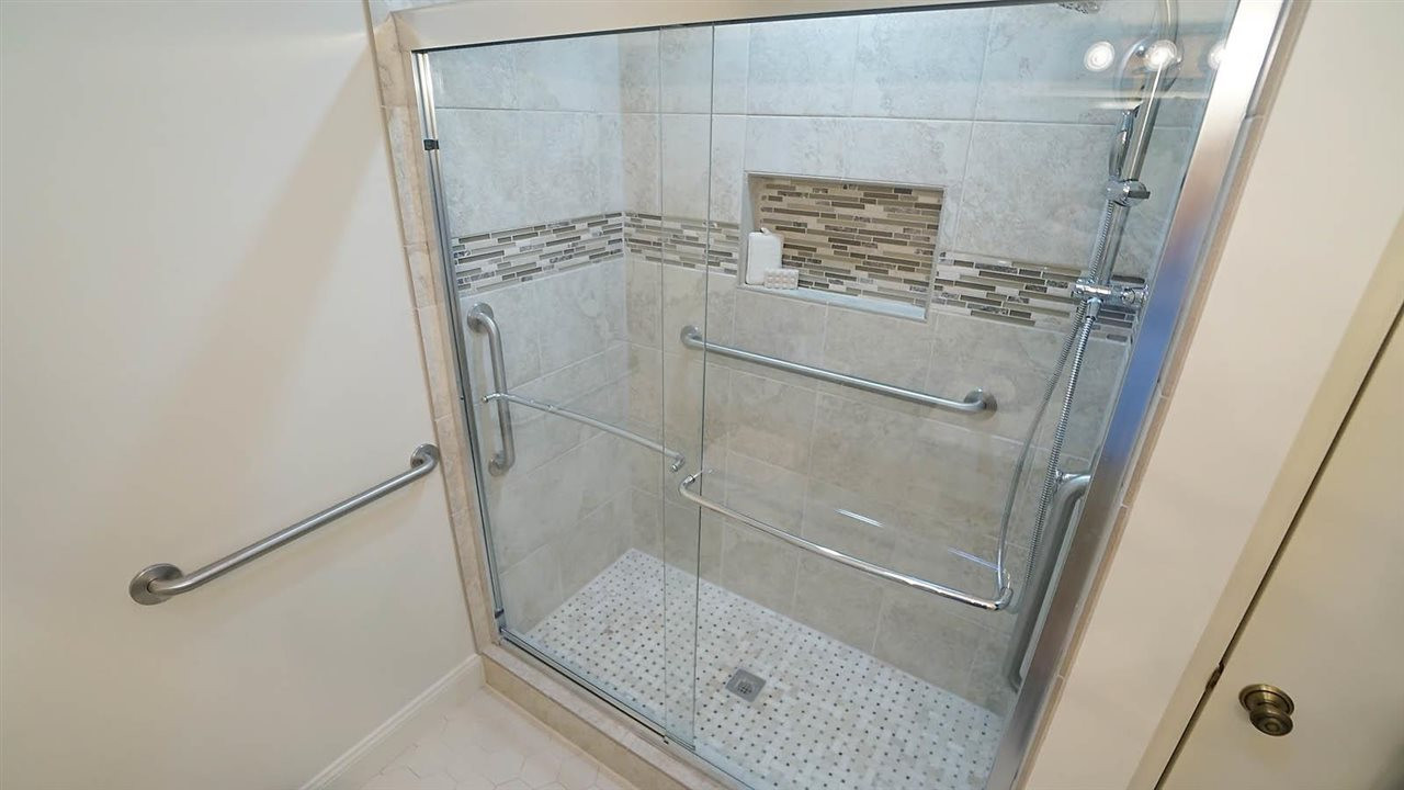 2801 Rue Sans Famille Raleigh, NC 27607 - Photo 14 of 26 Updgraded ceramic tile , walk-in shower with several hand rails for extra stability and safety Walk-in Shower