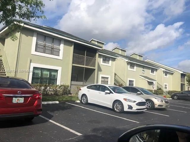 a view of a car parked in front of a house