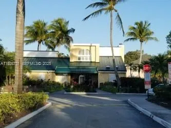 a front view of a house with small garden