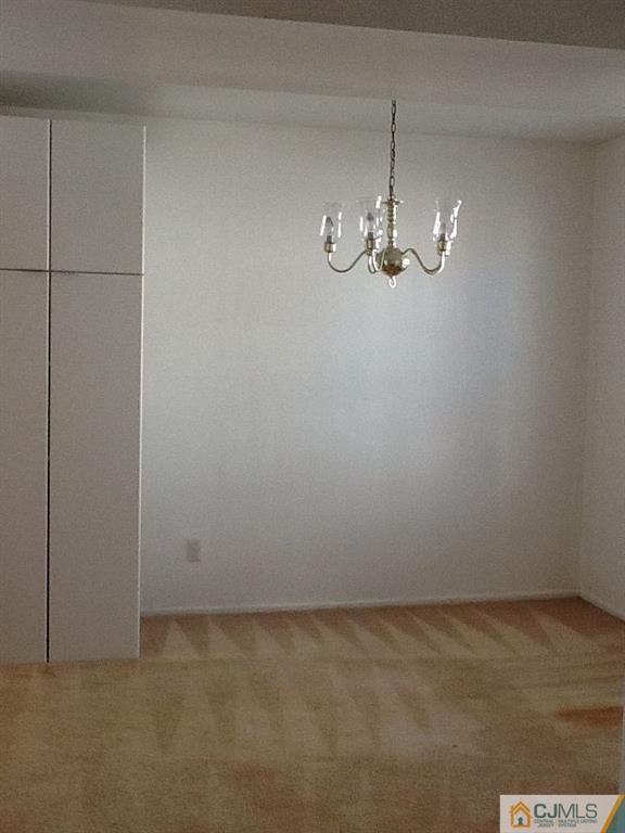 32 Boulder Drive, Unit 32 Edison, NJ 08817 - Photo 11 of 24 a view of a room with wooden floor and window