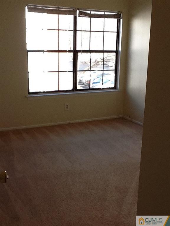 32 Boulder Drive, Unit 32 Edison, NJ 08817 - Photo 14 of 24 an empty room with a window