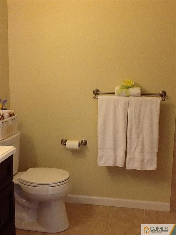 32 Boulder Drive, Unit 32 Edison, NJ 08817 - Photo 16 of 24 a white toilet sitting next to a bathroom sink