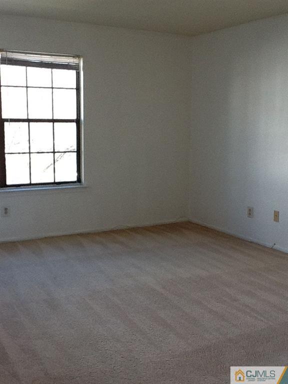 32 Boulder Drive, Unit 32 Edison, NJ 08817 - Photo 18 of 24 an empty room with a window