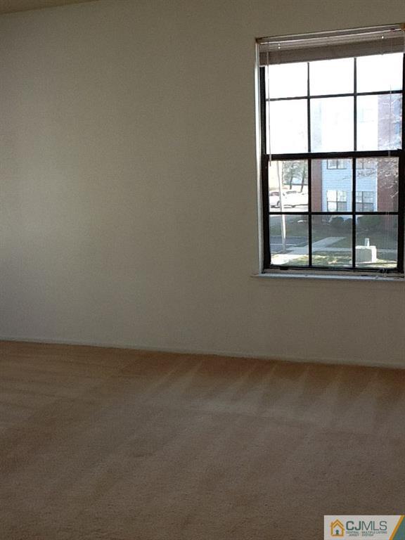32 Boulder Drive, Unit 32 Edison, NJ 08817 - Photo 19 of 24 an empty room with a window