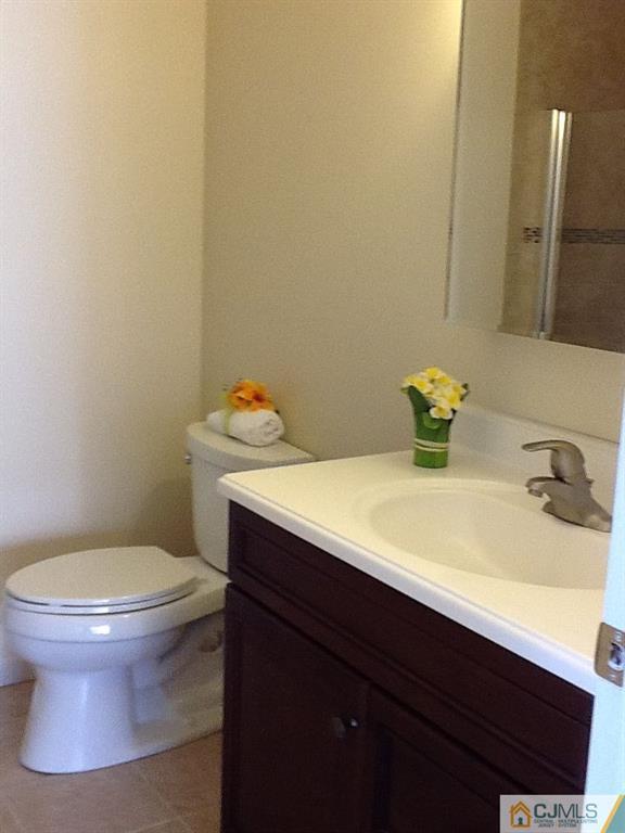 32 Boulder Drive, Unit 32 Edison, NJ 08817 - Photo 21 of 24 a bathroom with a sink and a toilet