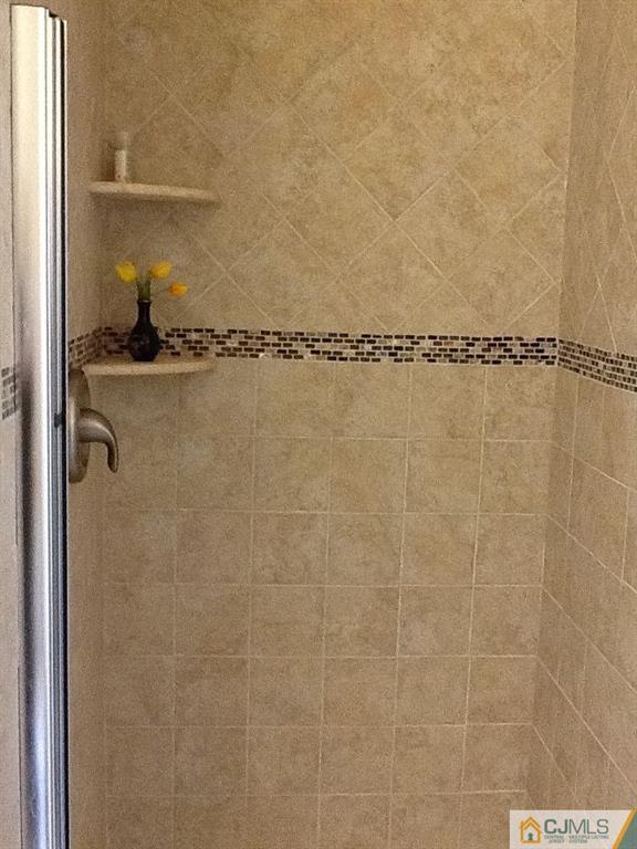 32 Boulder Drive, Unit 32 Edison, NJ 08817 - Photo 22 of 24 a bathroom with a shower