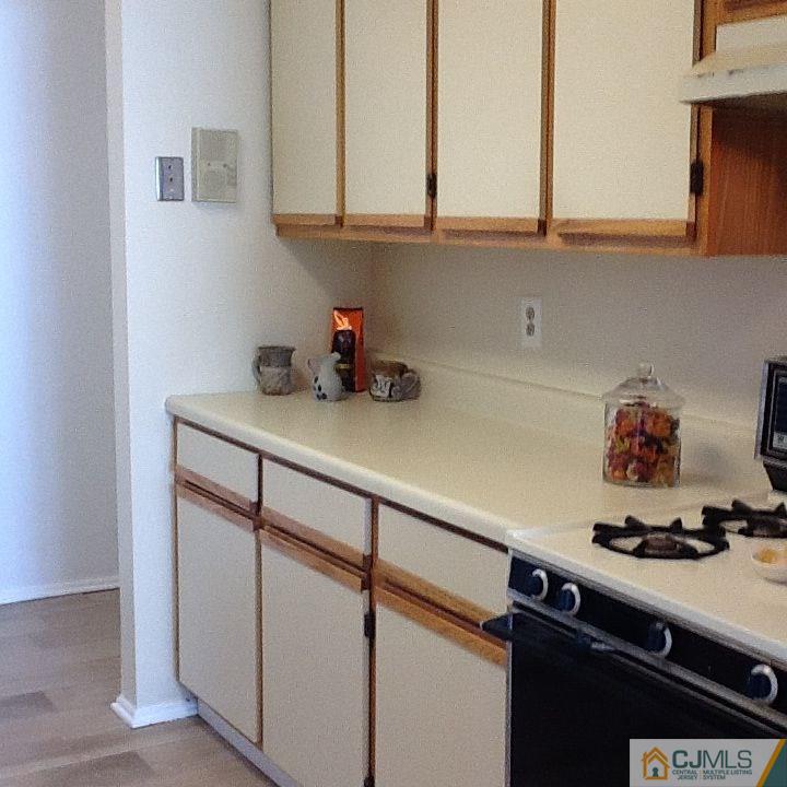 32 Boulder Drive, Unit 32 Edison, NJ 08817 - Photo 5 of 24 a kitchen with a sink cabinets and appliances