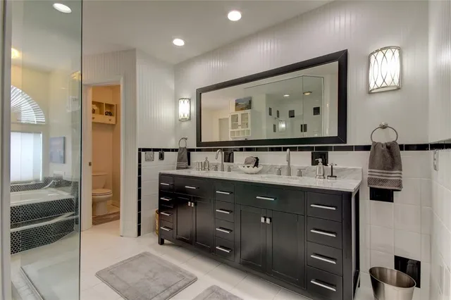 a view of a house with backyard swimming pool and sitting area