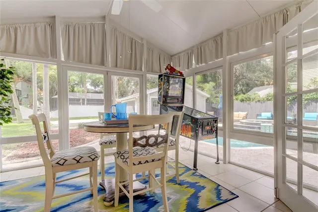 a front view of a house with swimming pool and furniture