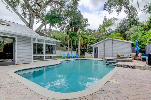 a room with furniture a rug and a wall painting