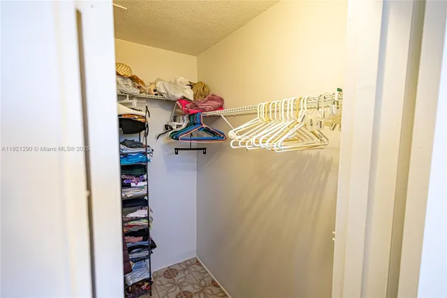 a living room with a couch and a chandelier