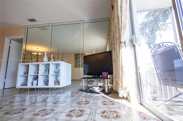 a room with furniture and a flat screen tv