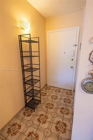 a view of a bathroom with a sink and a wooden floor