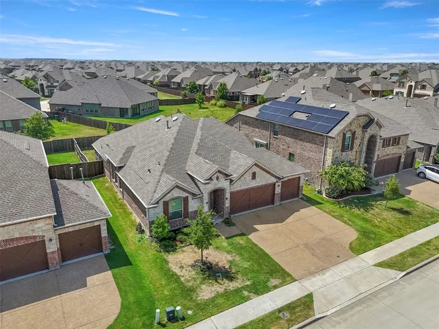 an aerial view of a house with a garden