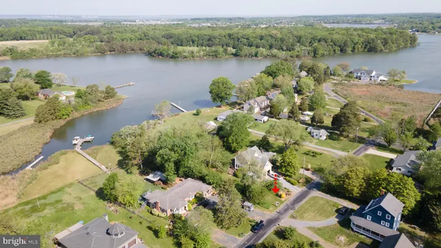 an aerial view of lake residential house with outdoor space and seating
