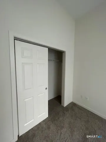 an empty room with closet area