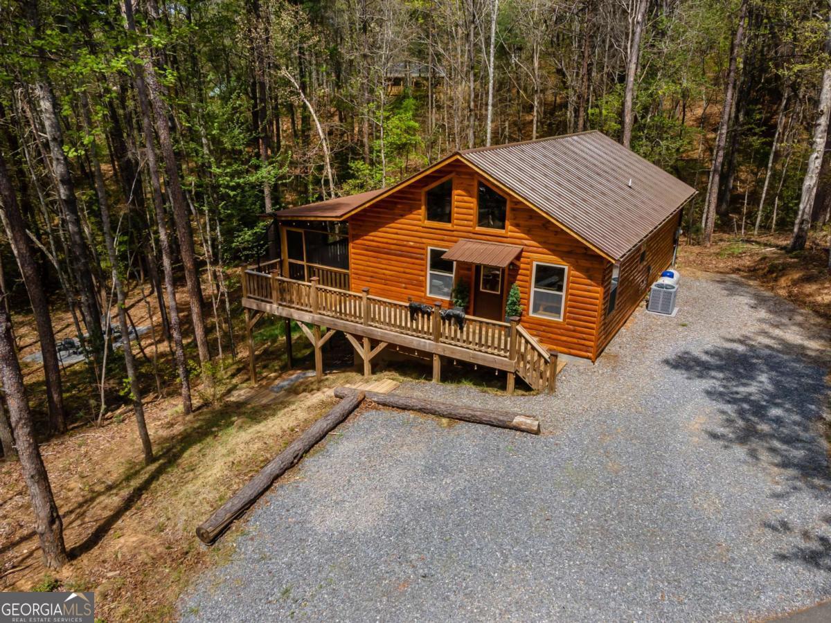 237 Bentley Cove, Unit 314 Murphy, NC 28906 - Photo 1 of 1 an aerial view of a house with a yard and balcony