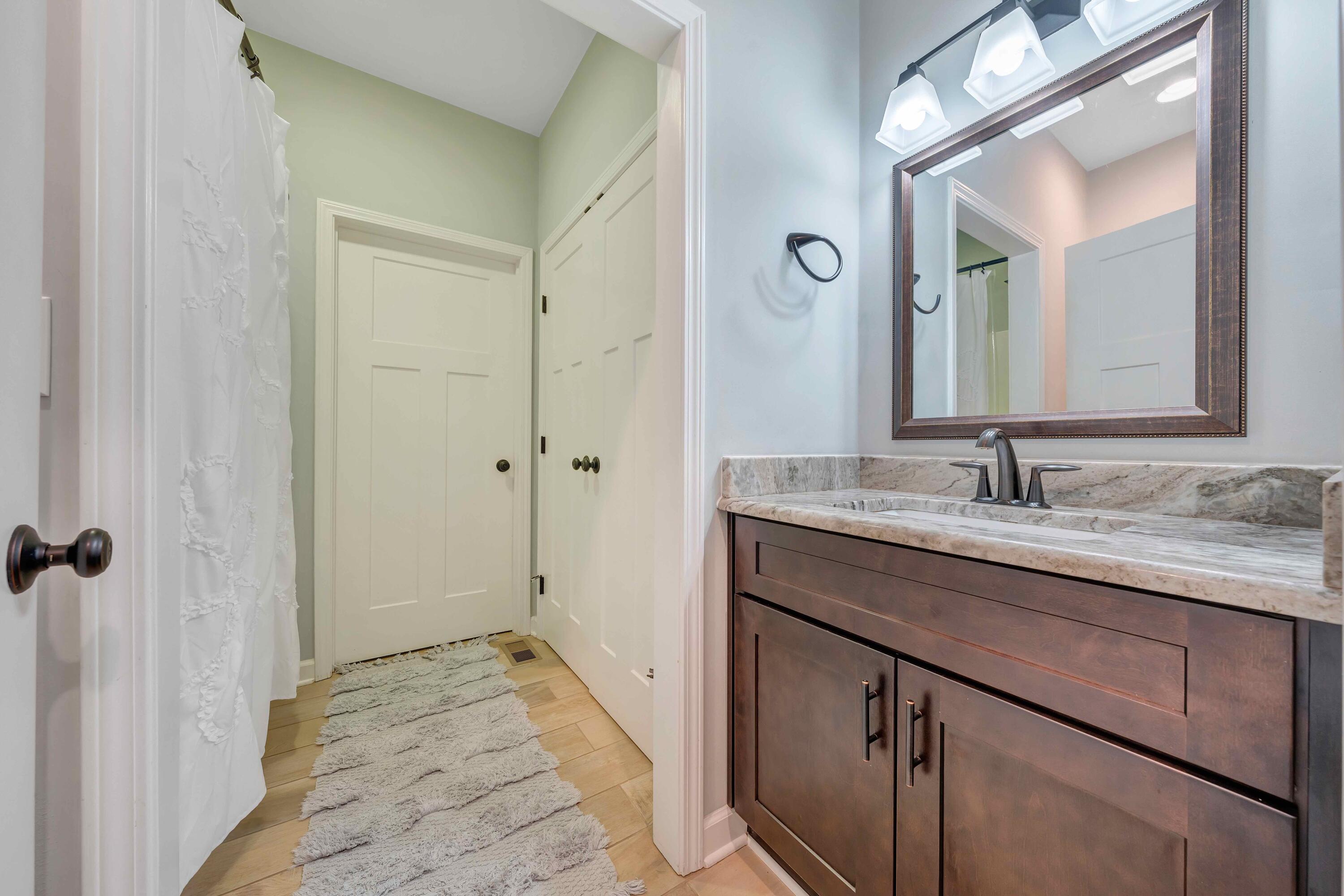 7041 Mountain Spring Trail Roanoke, VA 24018 - Photo 12 of 62 a bathroom with a granite countertop sink and a mirror