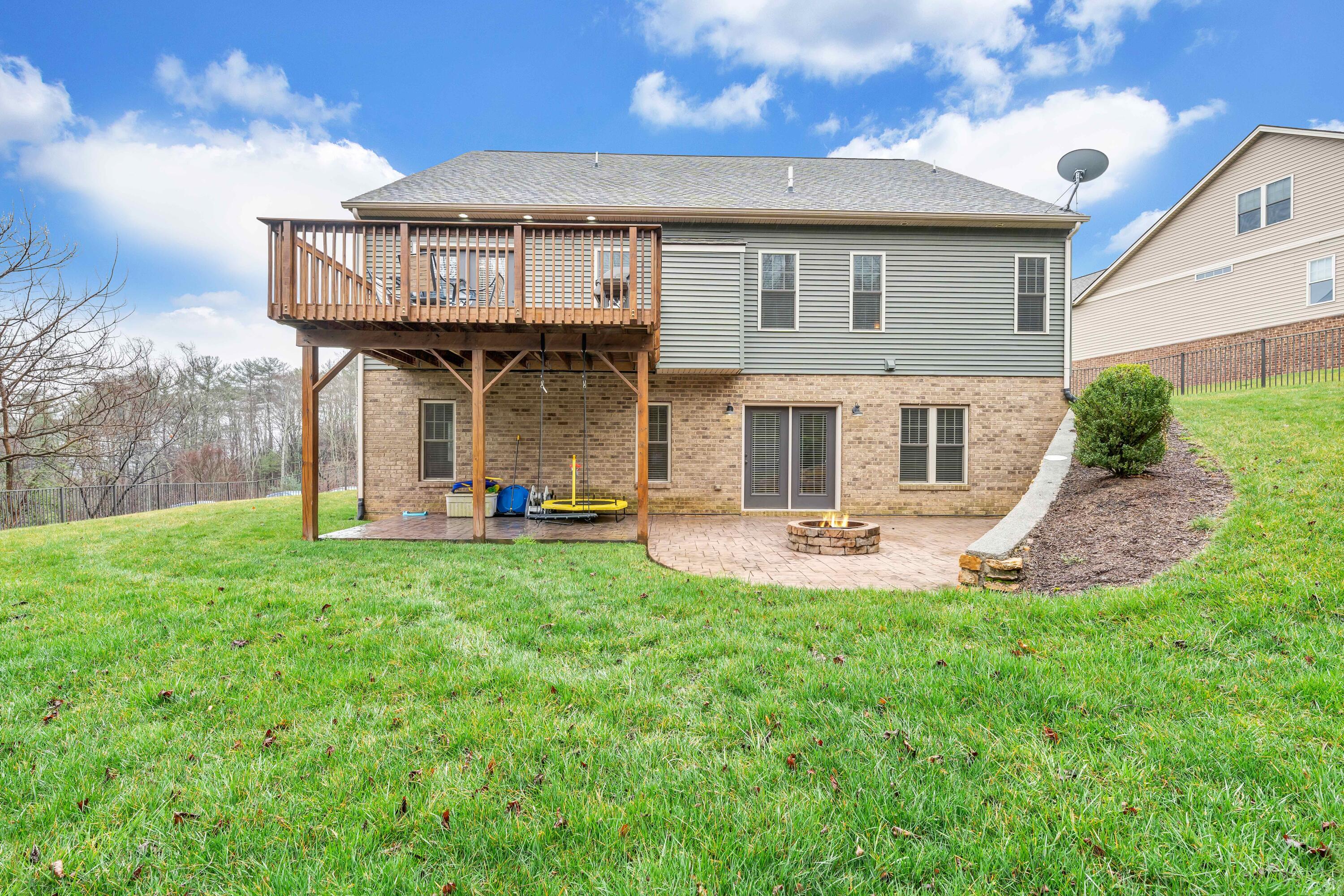 7041 Mountain Spring Trail Roanoke, VA 24018 - Photo 2 of 62 a view of a house with a yard and sitting area
