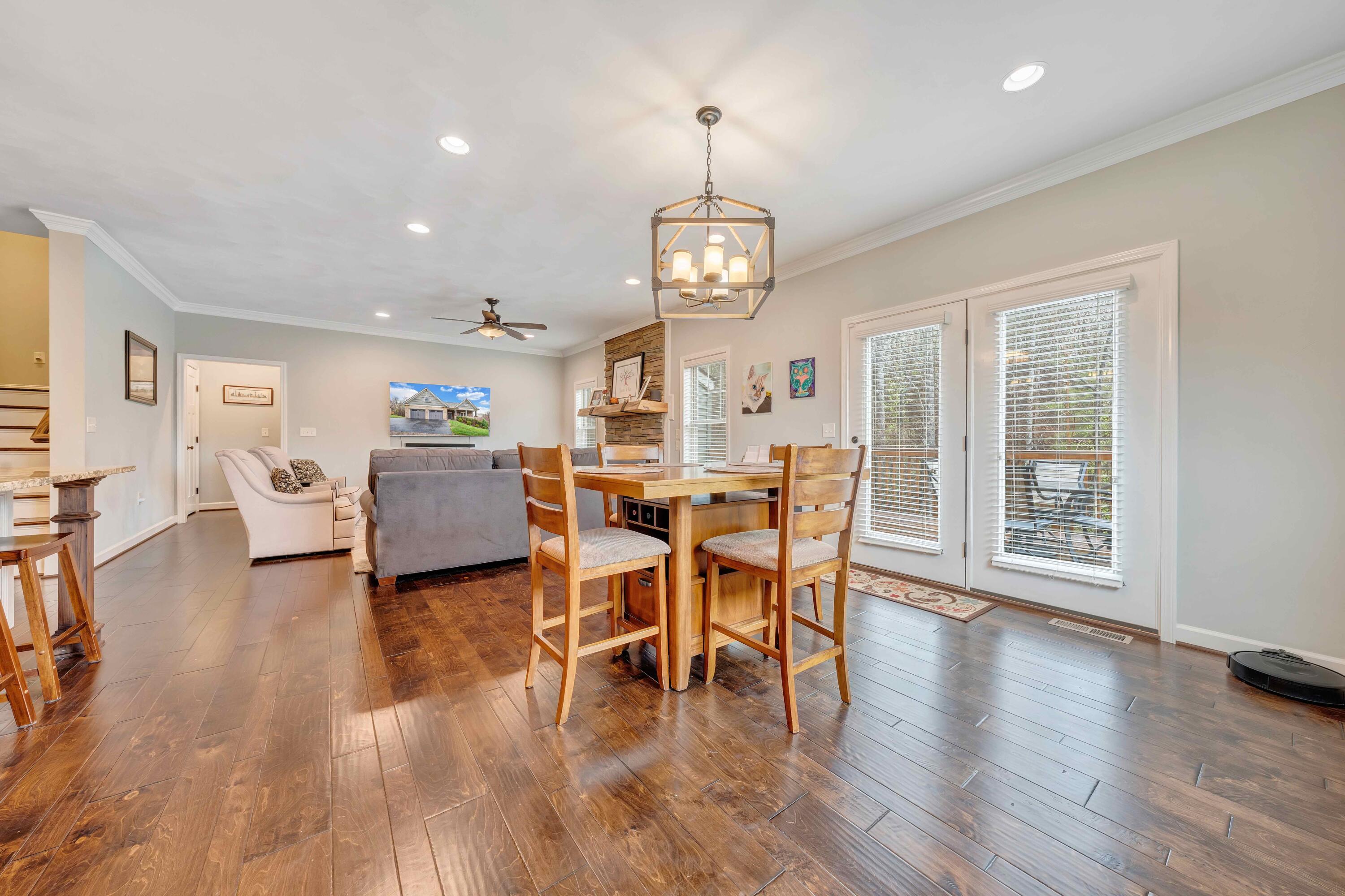 7041 Mountain Spring Trail Roanoke, VA 24018 - Photo 22 of 62 a view of a dining room with furniture window and wooden floor