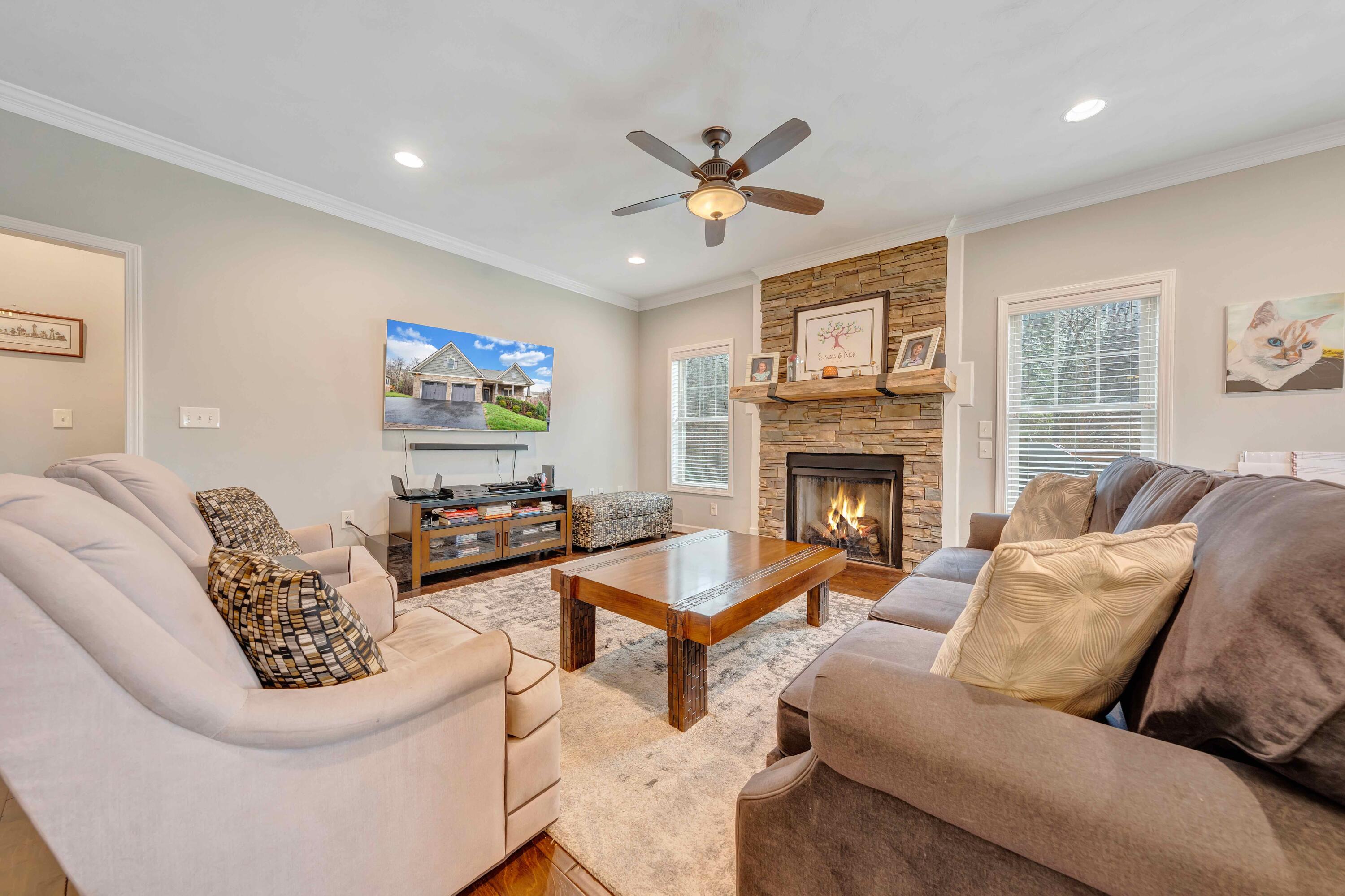 7041 Mountain Spring Trail Roanoke, VA 24018 - Photo 25 of 62 a living room with furniture a fireplace and a window