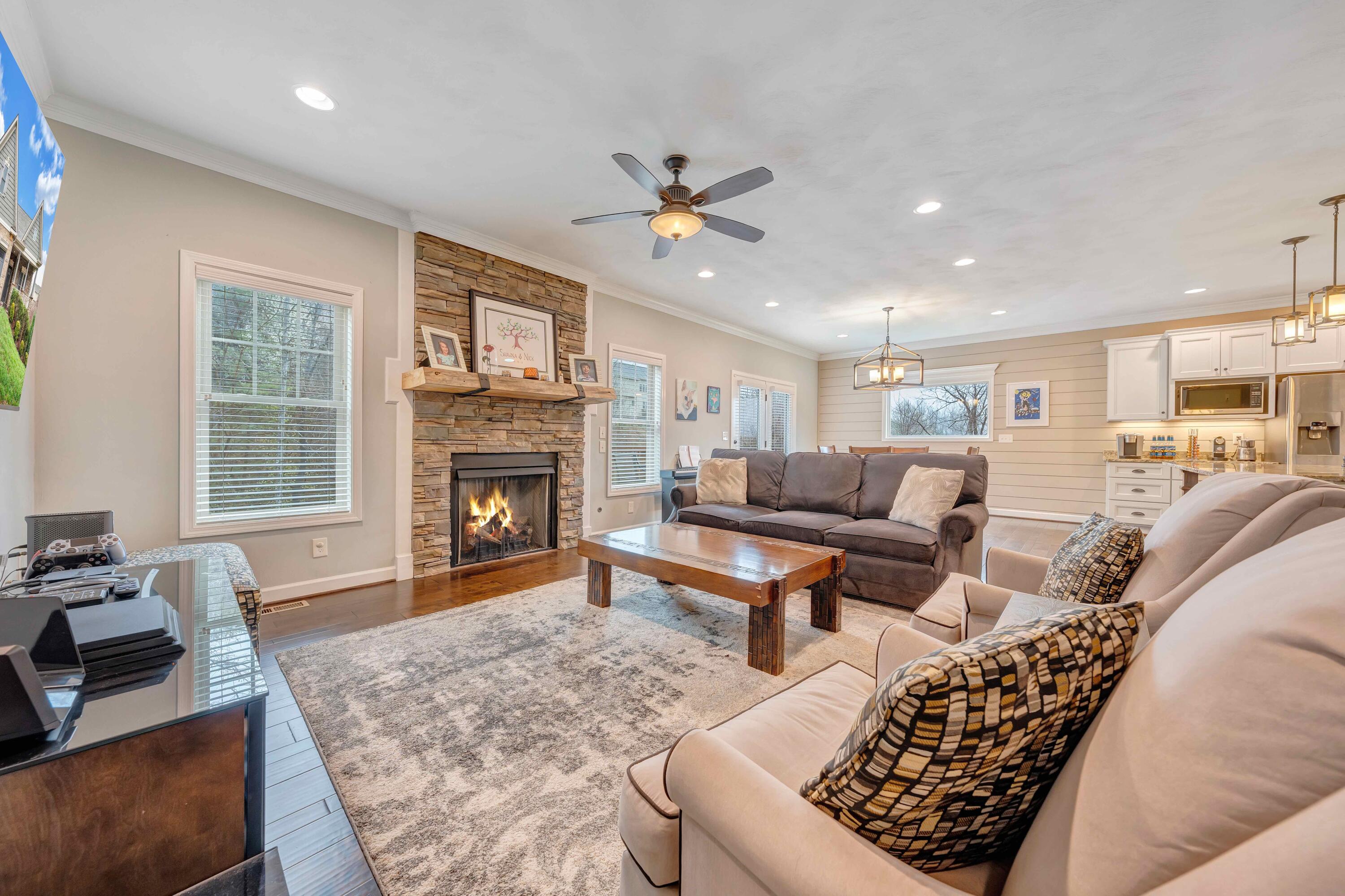 7041 Mountain Spring Trail Roanoke, VA 24018 - Photo 26 of 62 a living room with furniture a fireplace and a flat screen tv