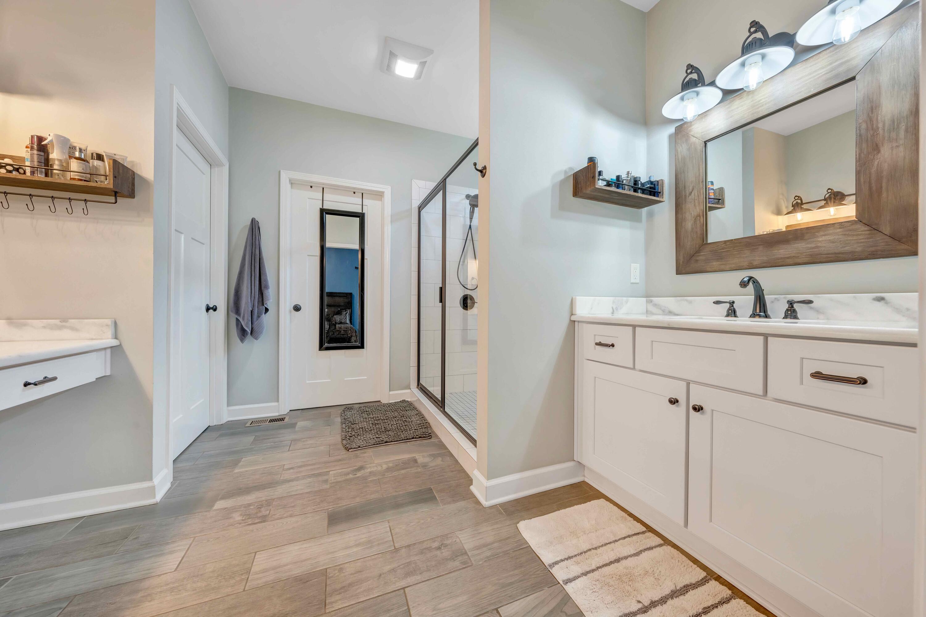 7041 Mountain Spring Trail Roanoke, VA 24018 - Photo 33 of 62 a bathroom with a sink and a mirror