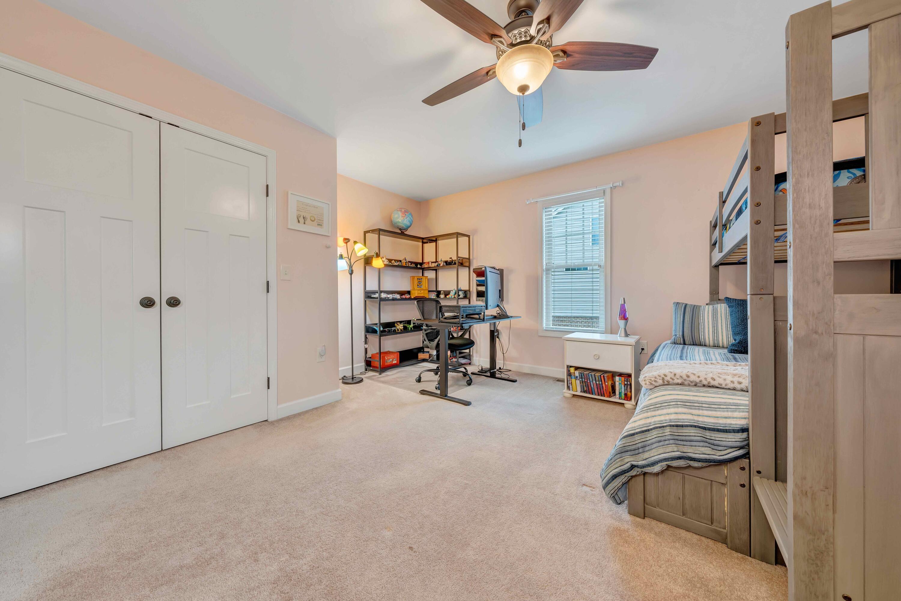 7041 Mountain Spring Trail Roanoke, VA 24018 - Photo 41 of 62 a bedroom with furniture and a chandelier