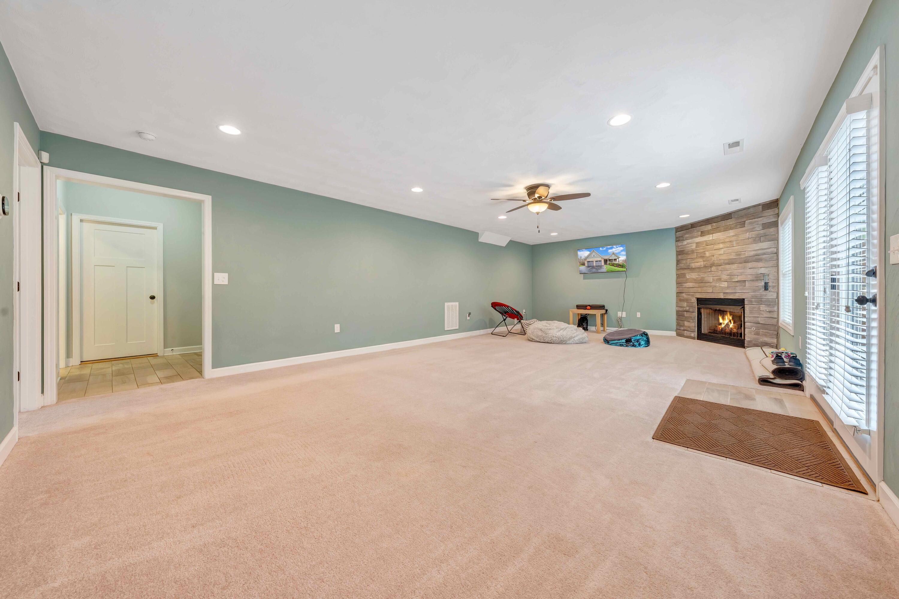 7041 Mountain Spring Trail Roanoke, VA 24018 - Photo 48 of 62 a very nice looking room with a fireplace and a couch