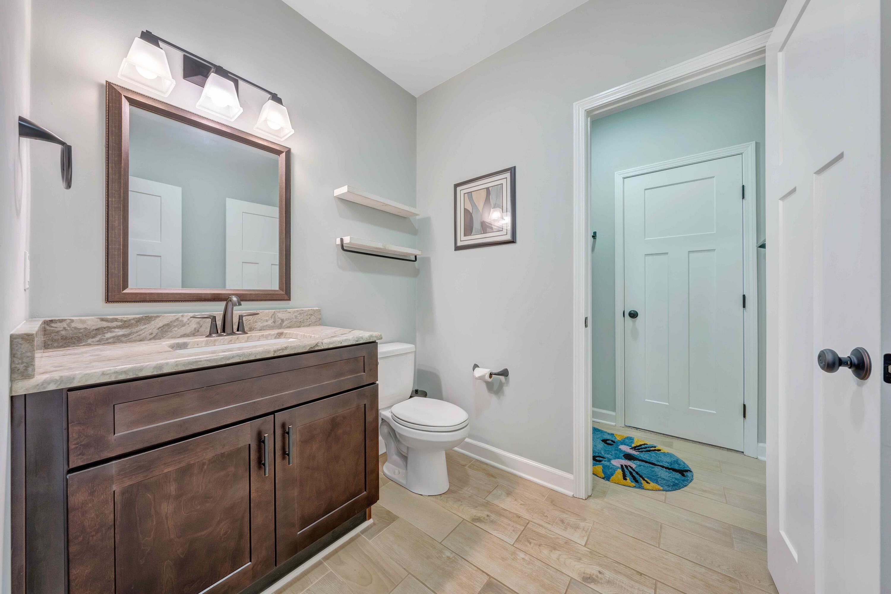7041 Mountain Spring Trail Roanoke, VA 24018 - Photo 51 of 62 a bathroom with a granite countertop sink toilet and shower