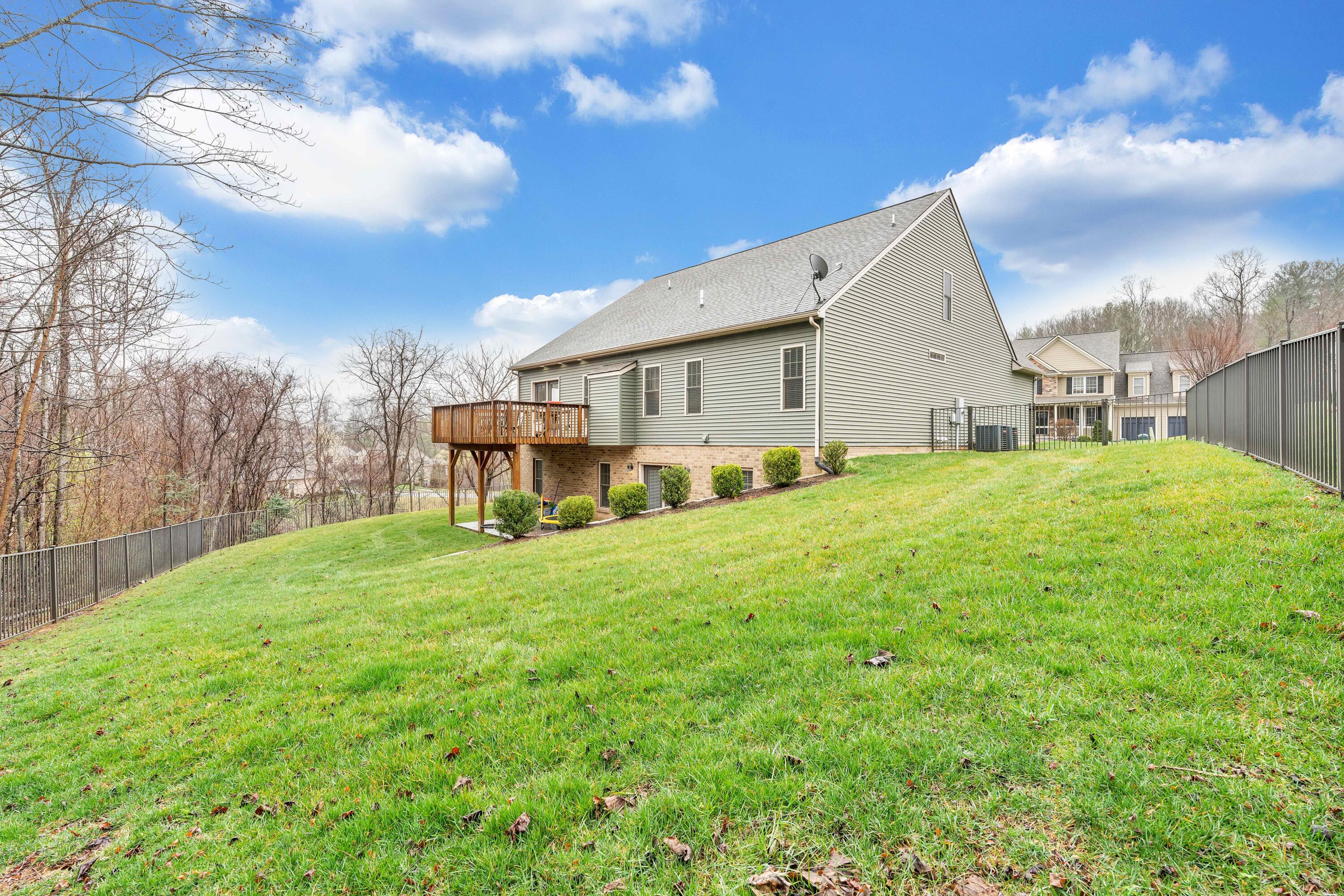 7041 Mountain Spring Trail Roanoke, VA 24018 - Photo 59 of 62 a view of a house with backyard and a tree
